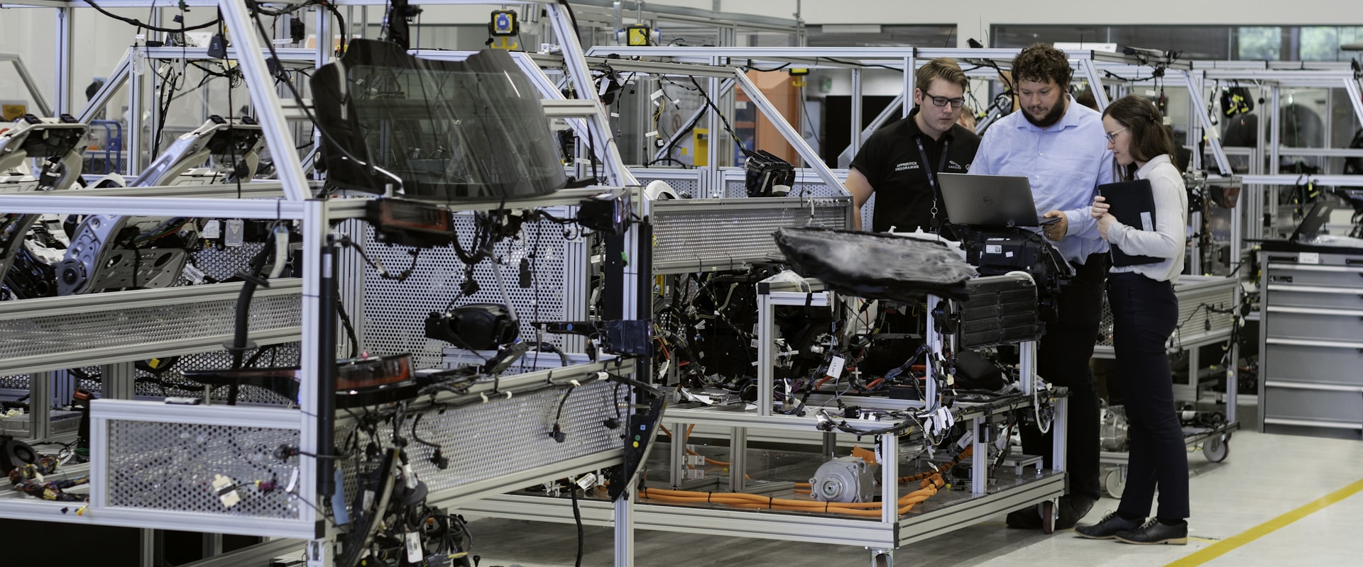 Engineers reviewing data beside an instrumented vehicle development rig